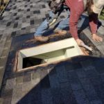 Man repairing roof