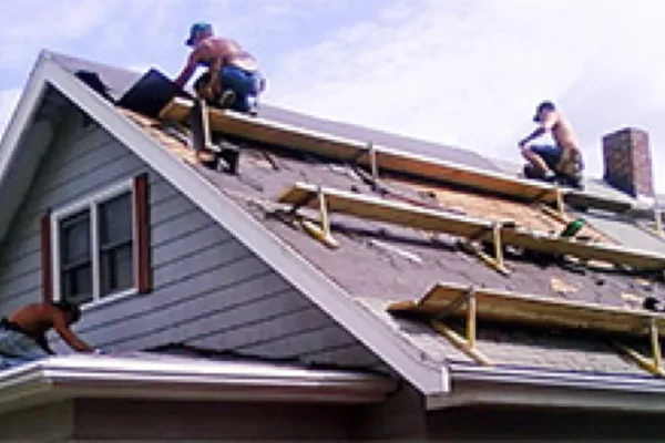 two men working on roof